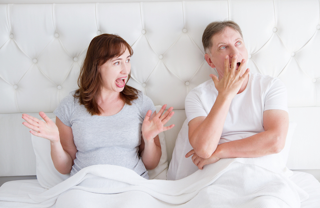 annoyed wife talking and bored husband not listening